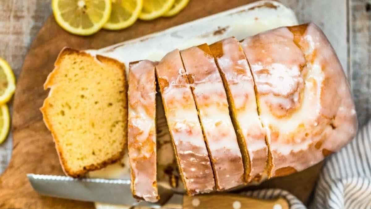 A slice of lemon pound cake on a cutting board.