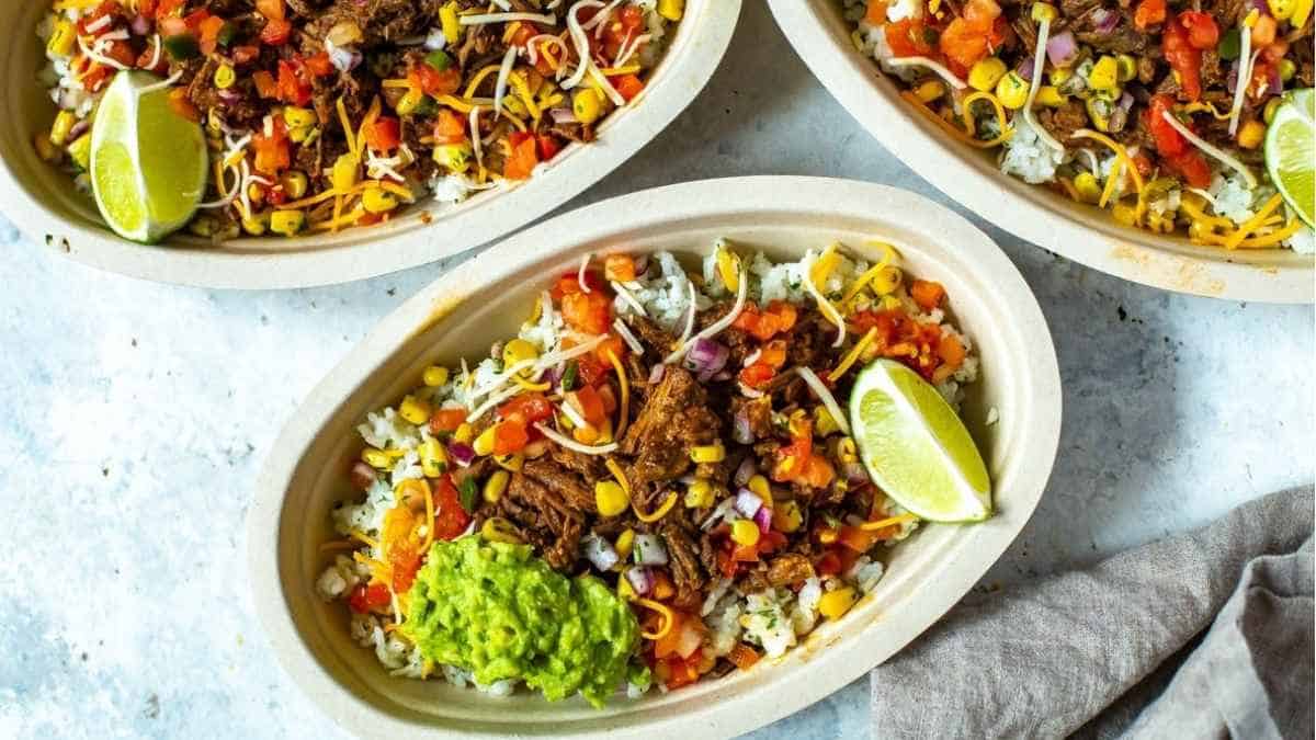 Three bowls of tacos with rice and guacamole.