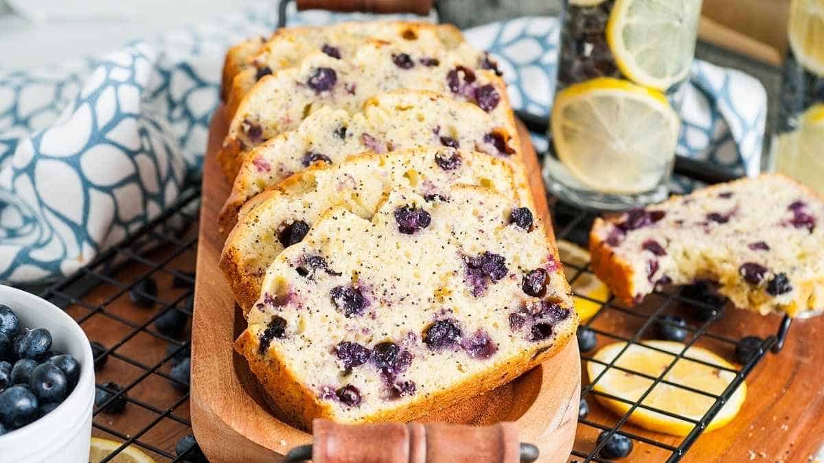 A loaf of blueberry bread on a tray.