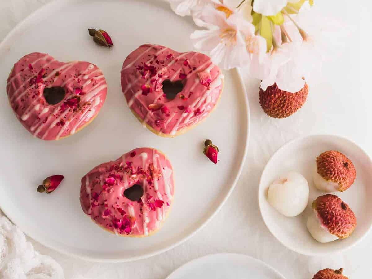 Valentine's day donuts with strawberries and icing.