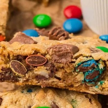 M&m cookie bars stacked on top of each other.