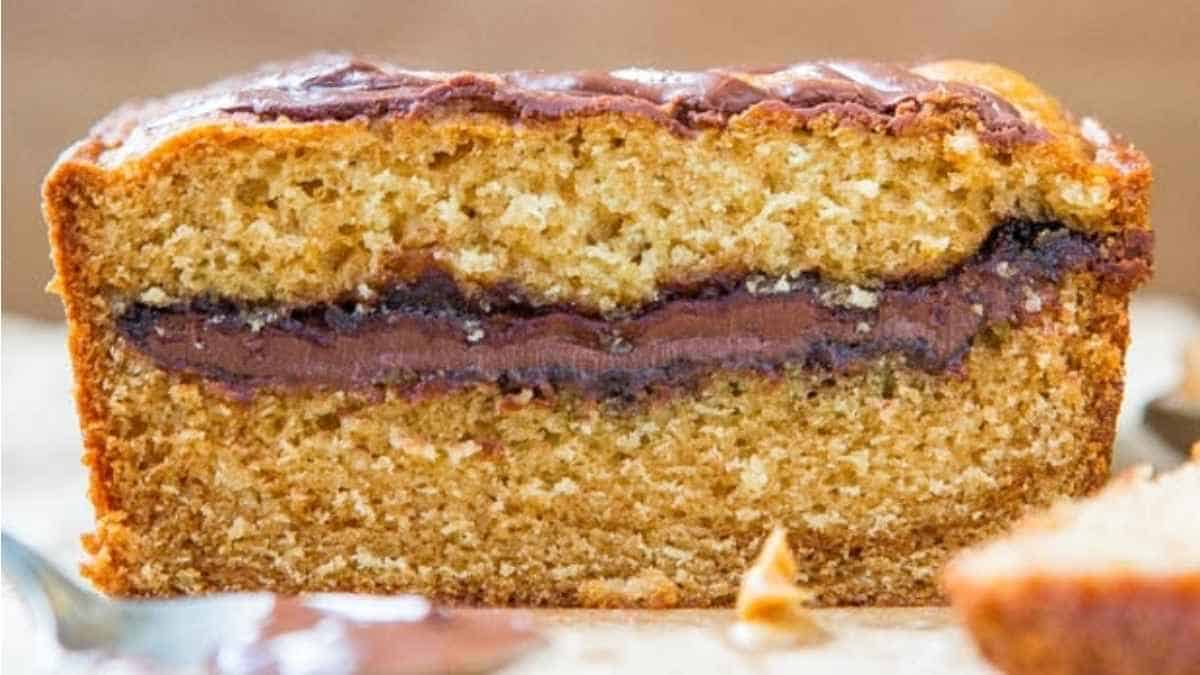 A slice of peanut butter banana bread with a fork.