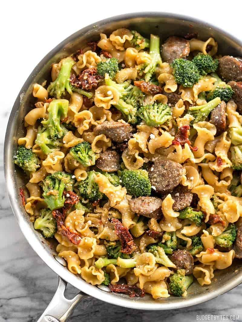 A flavorful pan full of pasta with sausage and broccoli, showcasing delicious sausage recipes.