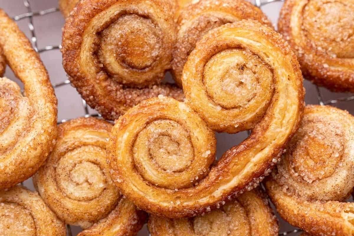 Swedish cinnamon buns on a cooling rack.