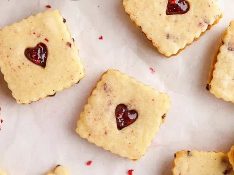 Valentine's day cookies with raspberries and hearts.