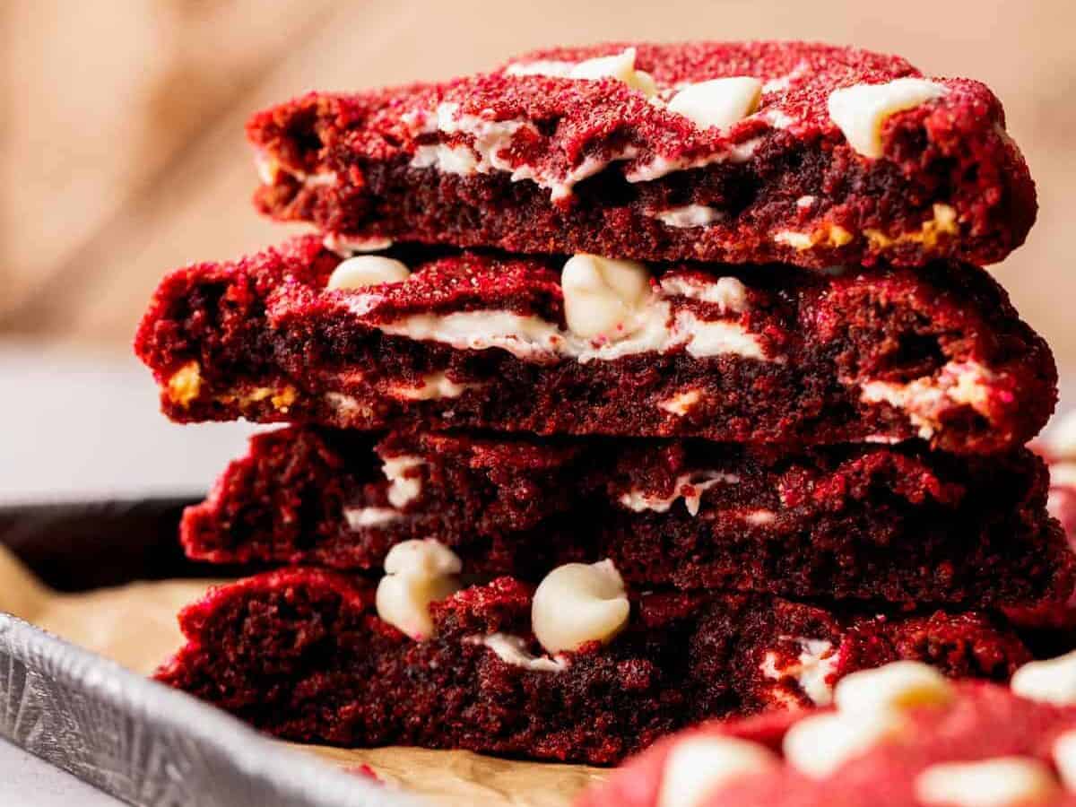 A stack of red velvet cookies on a tray.