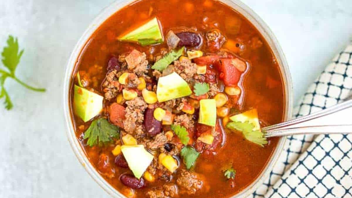 A bowl of beef chili with avocado and avocado.