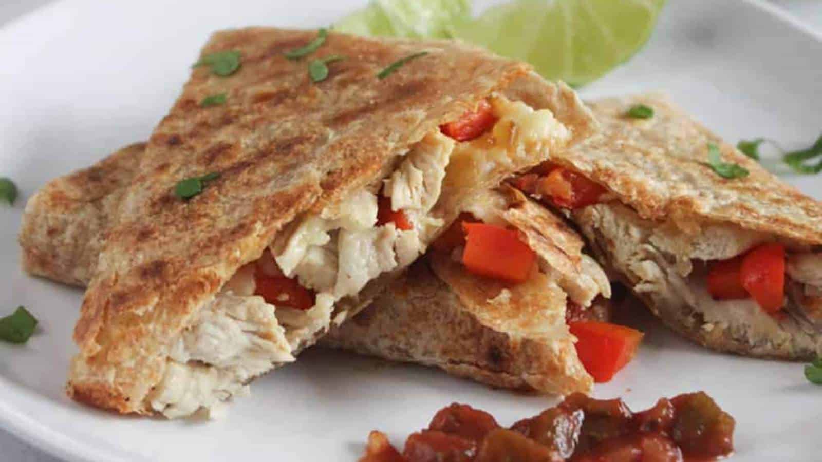 Chicken quesadillas on a white plate.