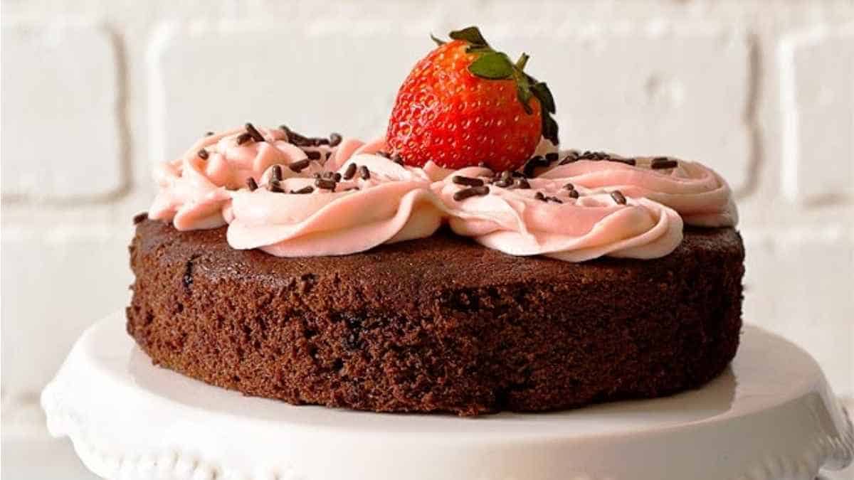 A chocolate cake with a strawberry on top.