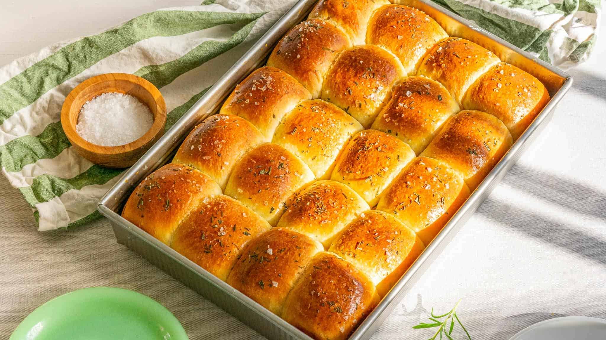 A loaf of bread in a pan on a table.
