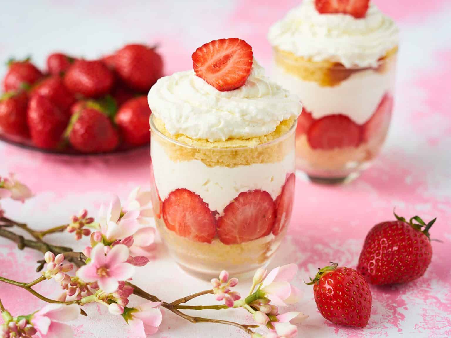 Strawberry trifle with whipped cream and strawberries.