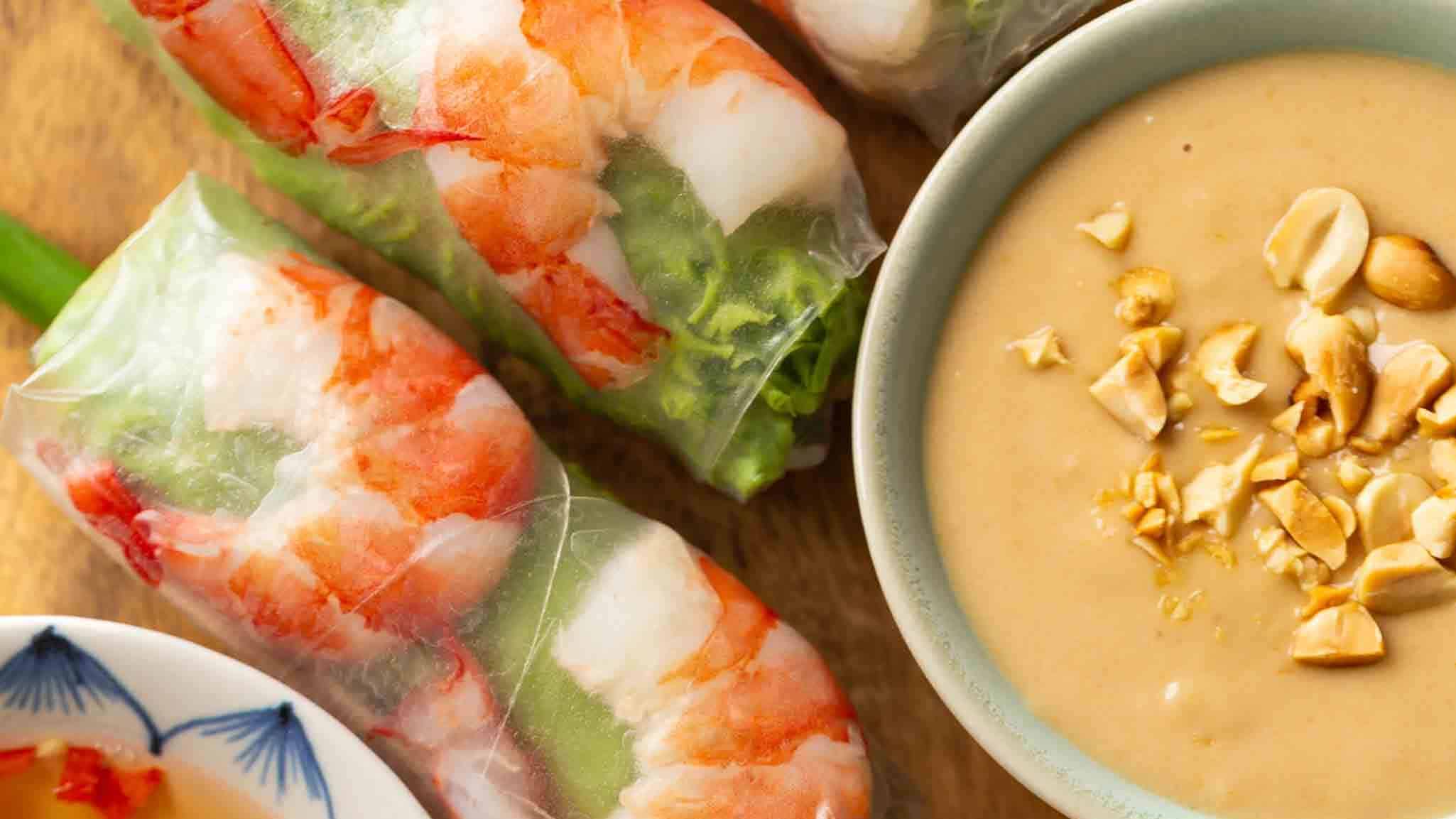 Shrimp spring rolls with peanut sauce.
