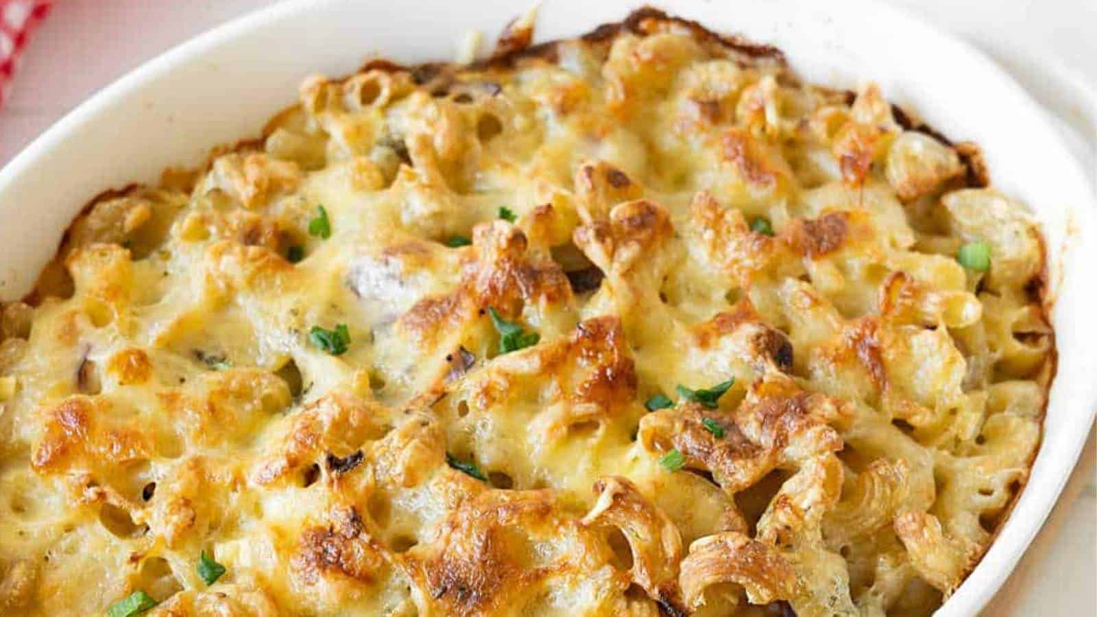 Cheesy mushroom macaroni and cheese in a white dish.