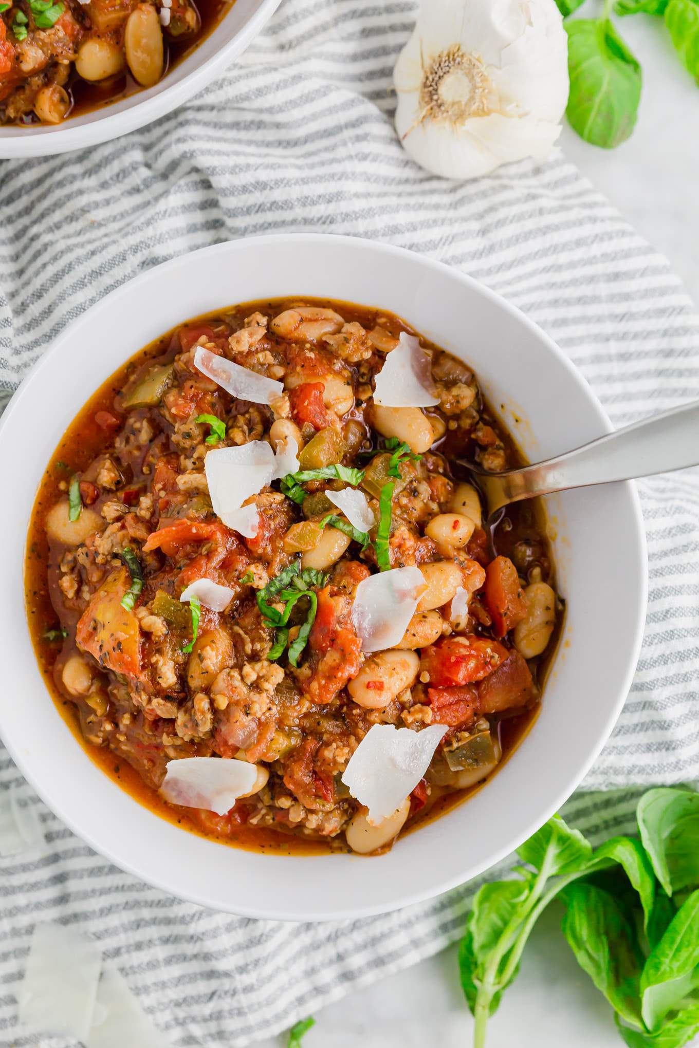 A zesty bowl of chili with flavorful ground sausage, tomatoes and basil.
