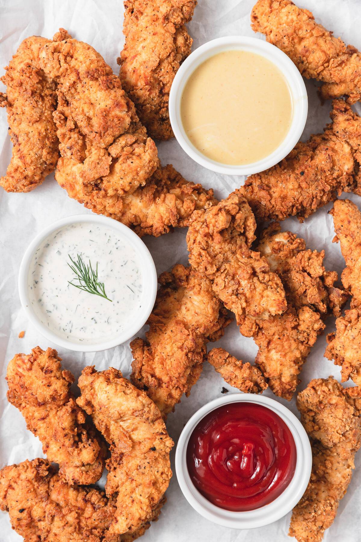 Crispy chicken tenders with a delectable dipping sauce.