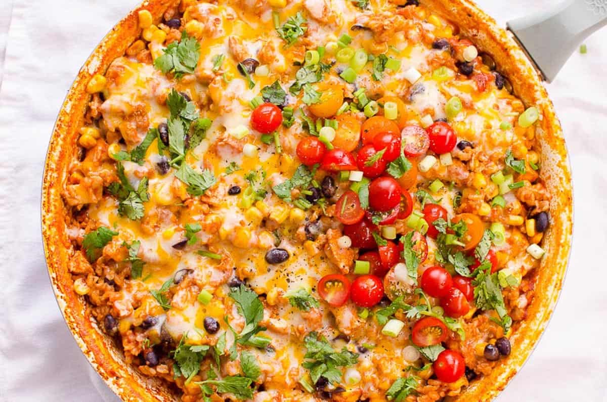 Mexican casserole in a dish with a fork.