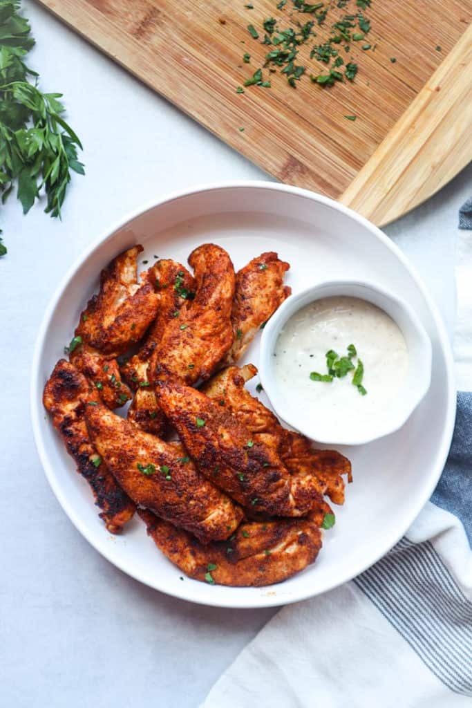 A plate of chicken wings with a flavorful sauce.
