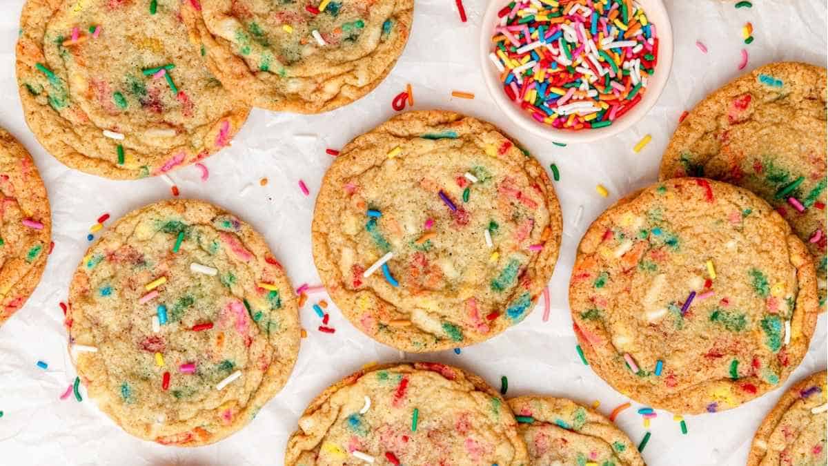 Colorful sprinkle cookies on a white paper.