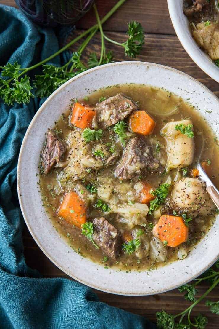 A hearty bowl of stew with tender chuck steak, golden potatoes, sweet carrots, and a sprinkle of fresh parsley.