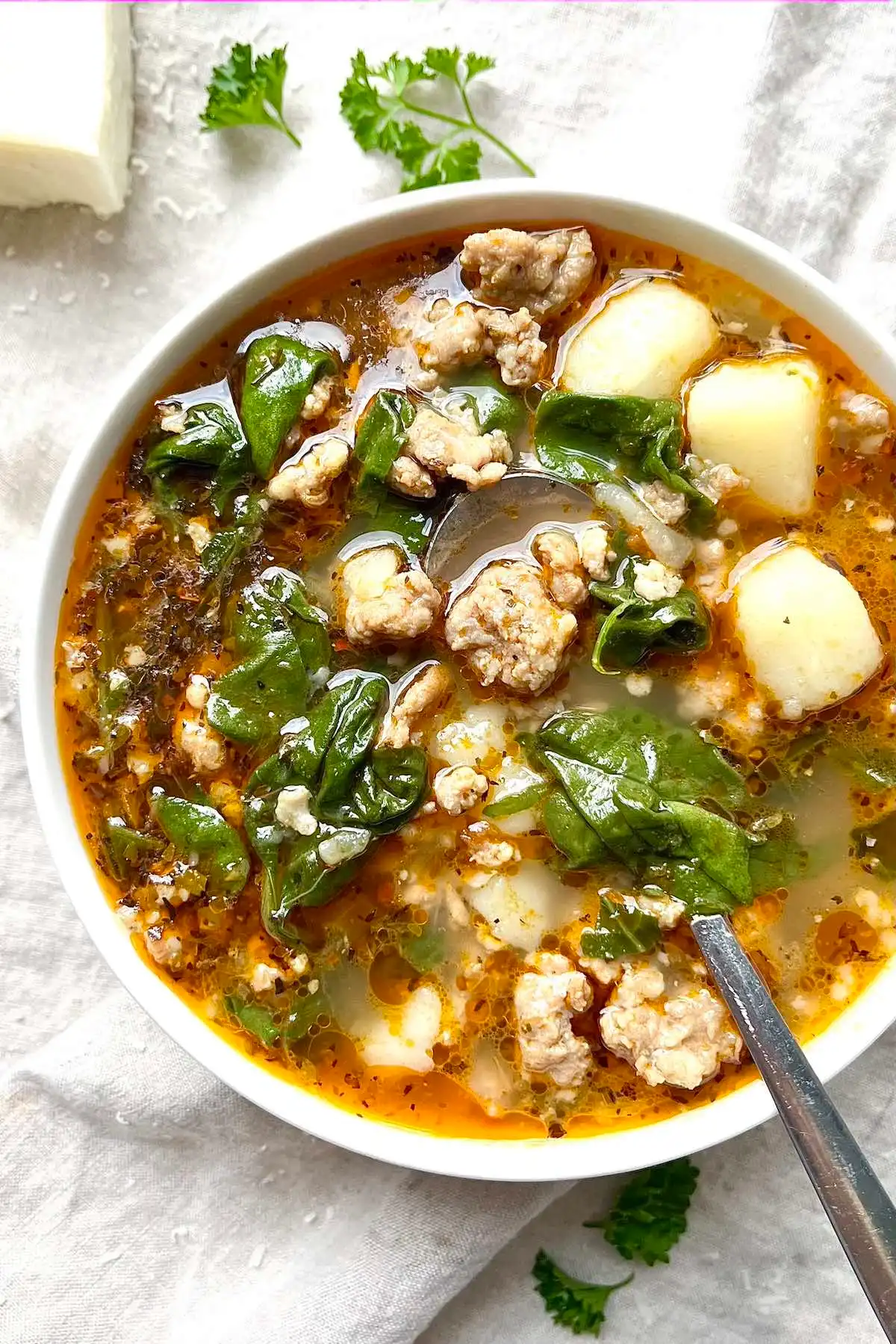 A hearty bowl of soup packed with flavorful meat and a medley of vegetables.
