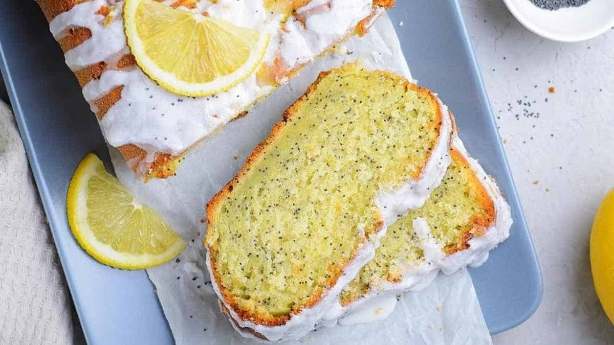 A slice of lemon poppy seed bread on a blue plate.