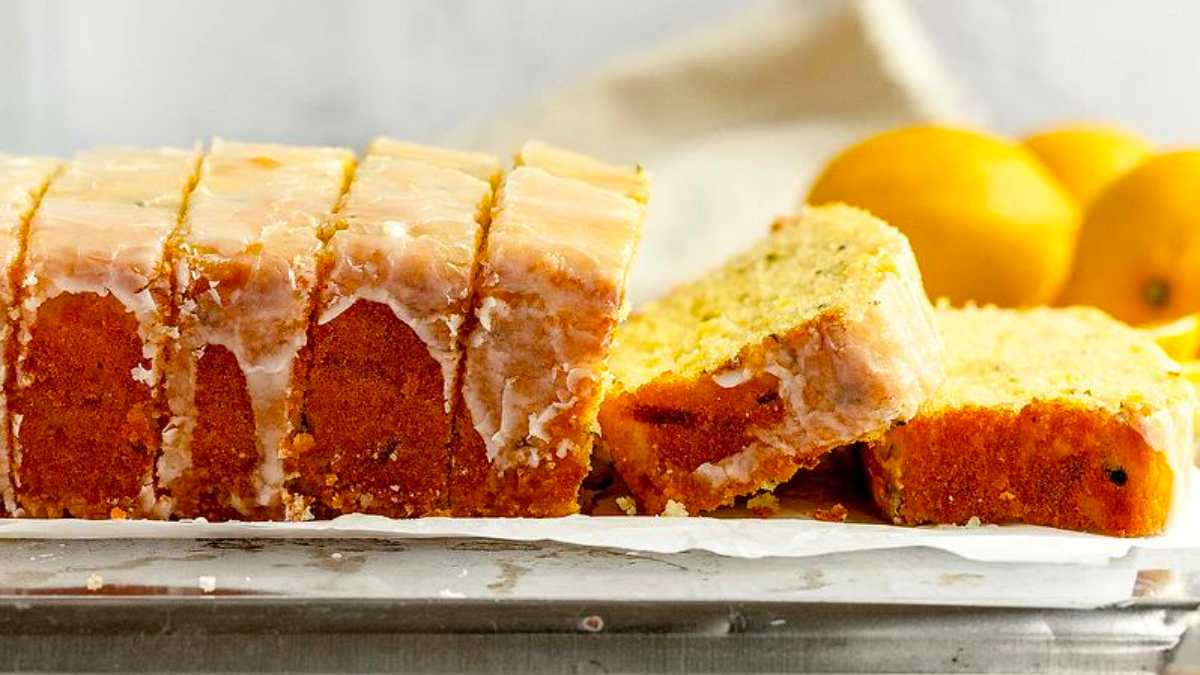 A loaf of lemon pound cake with icing on top.