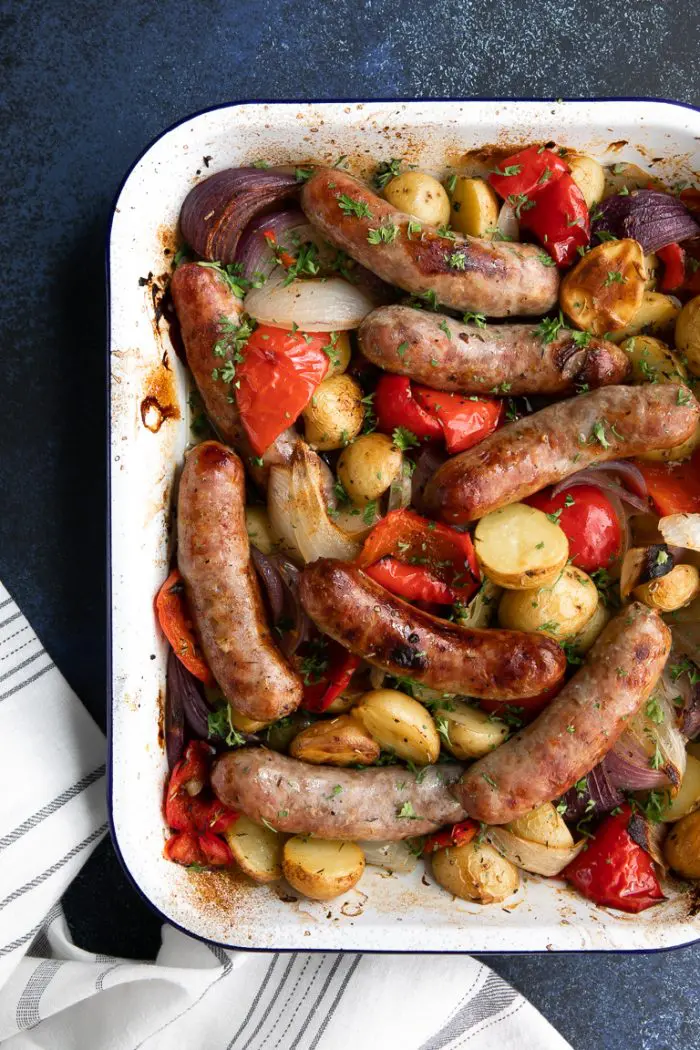 A delicious sausage recipe combining potatoes and vegetables in a baking dish.
