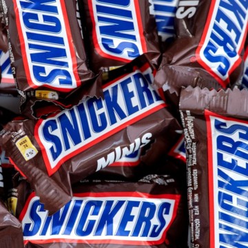 A pile of snickers chocolate bars.