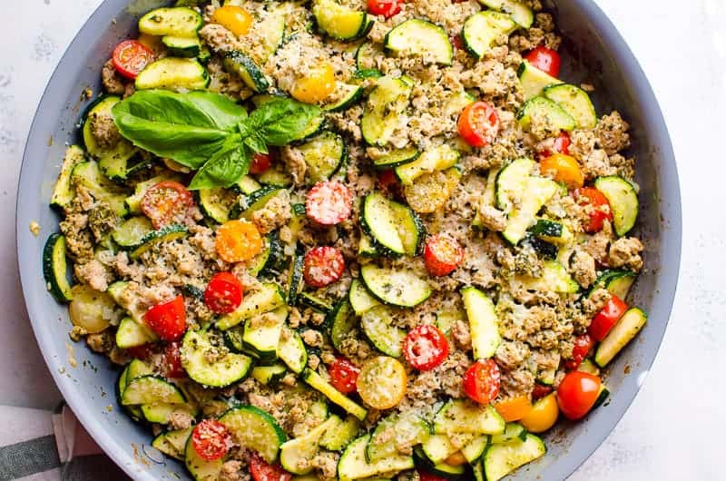 Zucchini quinoa salad with tomatoes and basil.