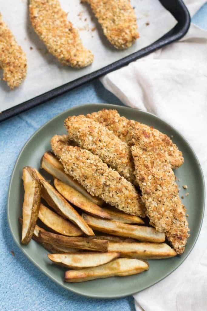 A plate with crispy fried chicken and golden french fries.