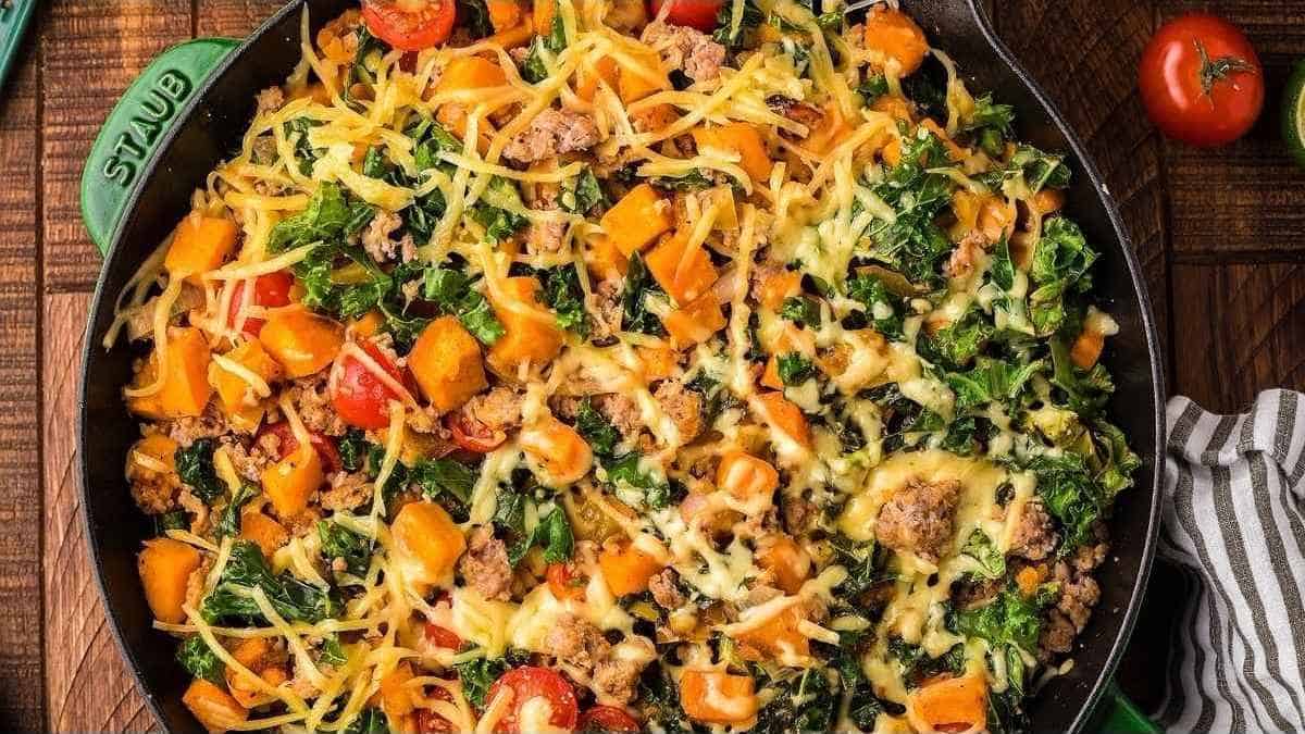 A skillet full of vegetables and meat in a skillet.
