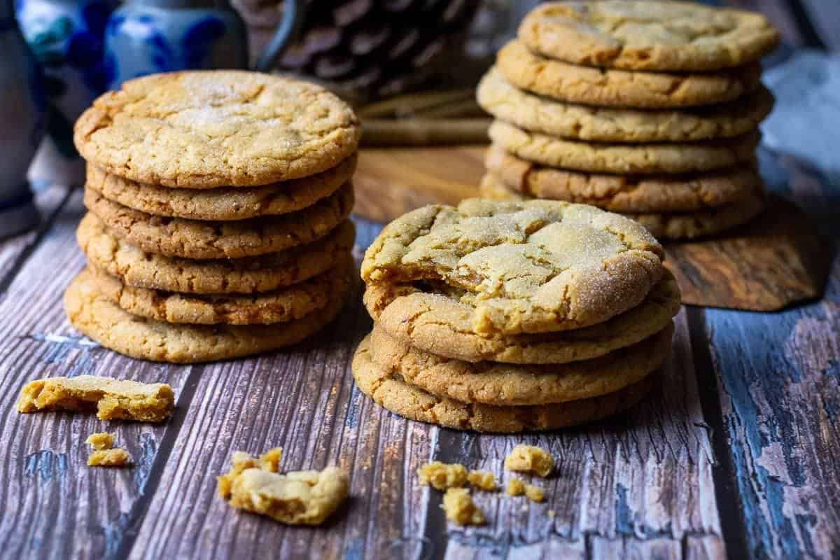 A stack of unique cookies on a wooden table.
