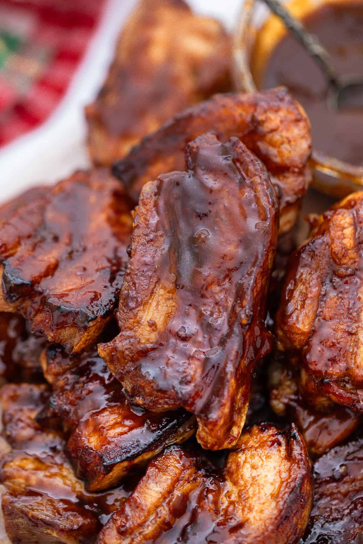 Delicious bbq ribs with sauce on a plate, perfect pork belly recipe.
