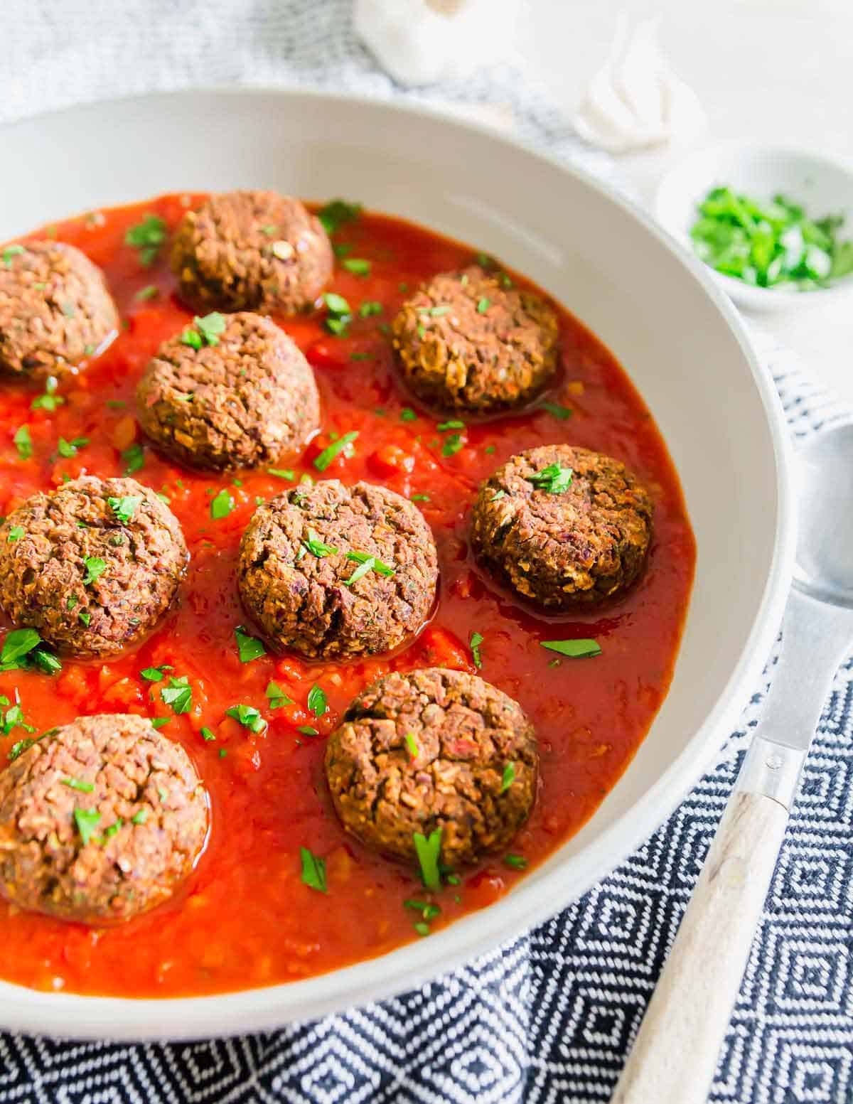 Looking for a vegan way to enjoy meatballs? Try these easy gluten-free, vegan black bean "meatballs" over pasta with your favorite tomato sauce. / Looking for a vegan way to enjoy meatballs? Try these easy gluten-free, vegan black bean "meatballs" over pasta with your favorite tomato sauce.
