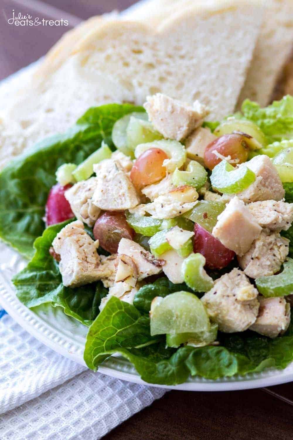 Chicken salad with grapes and lettuce on a plate.