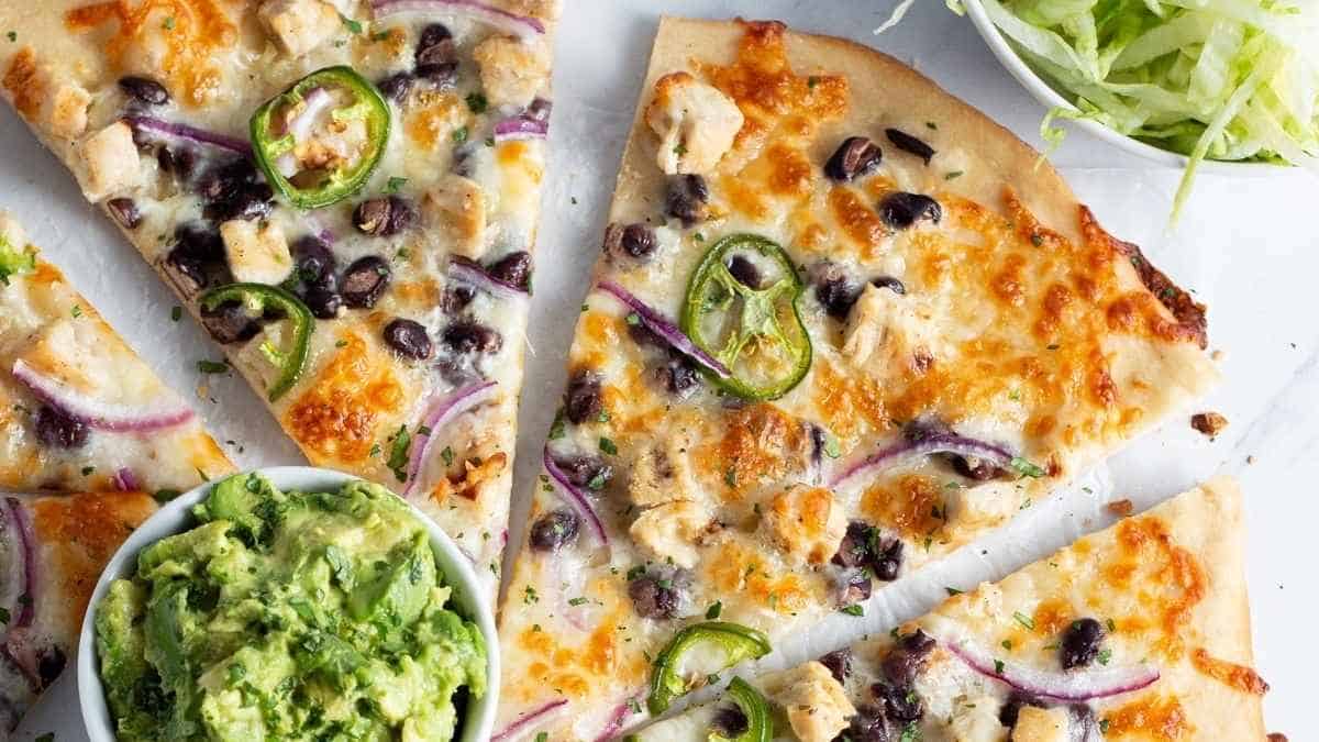 Chicken and black bean pizza with guacamole.