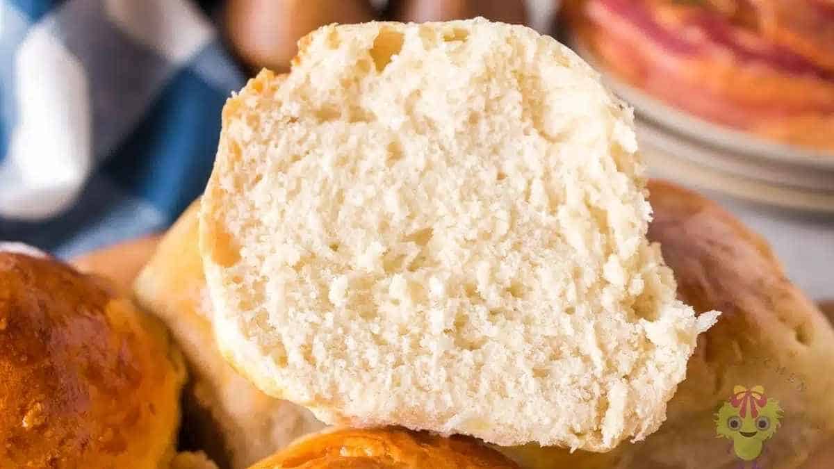 A loaf of bread with a slice taken out of it.