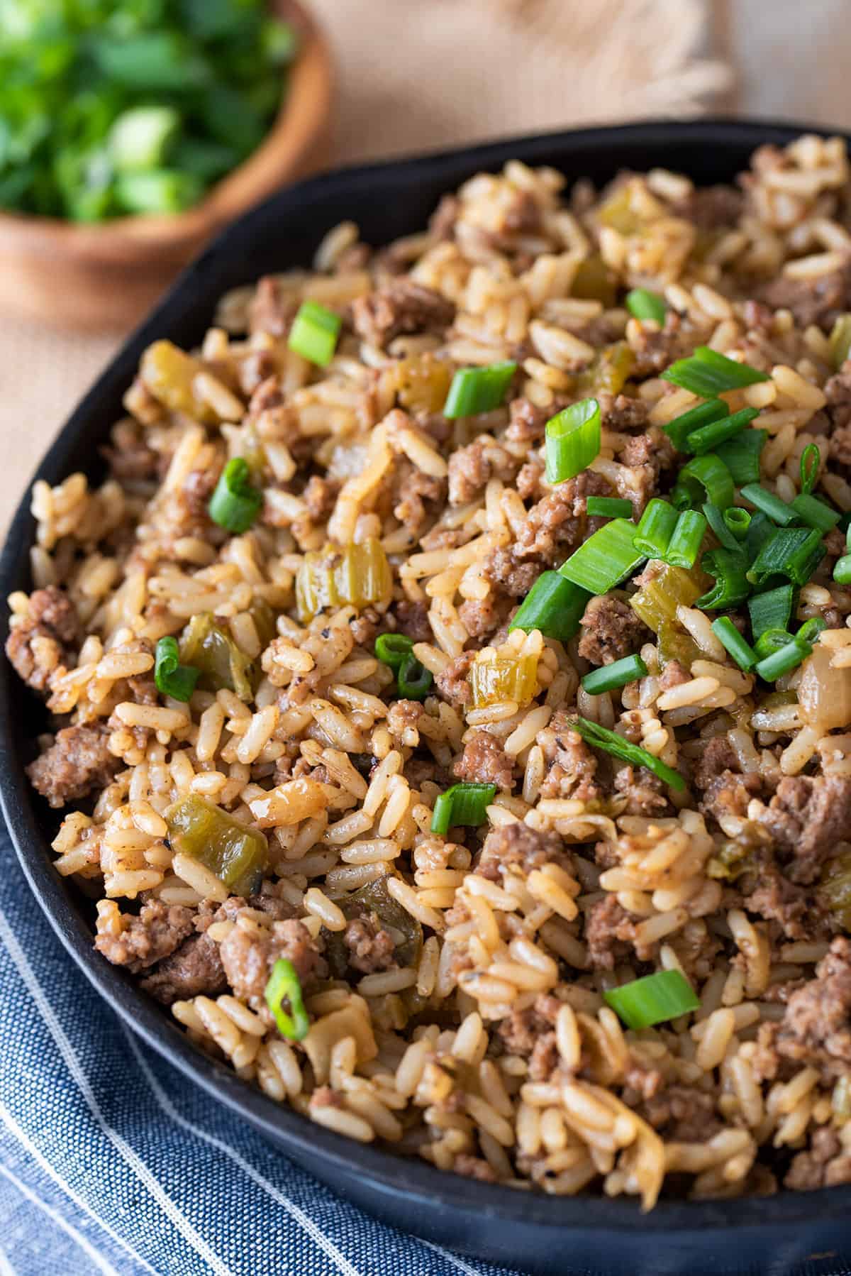A skillet filled with rice and meat.