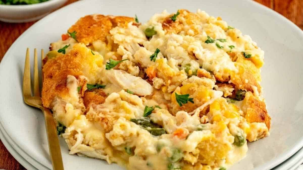 Chicken casserole on a white plate with a fork.