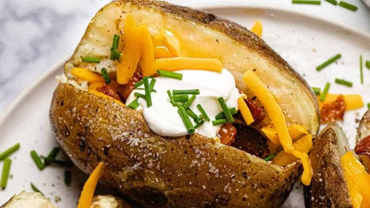 Baked potatoes topped with cheese and sour cream.