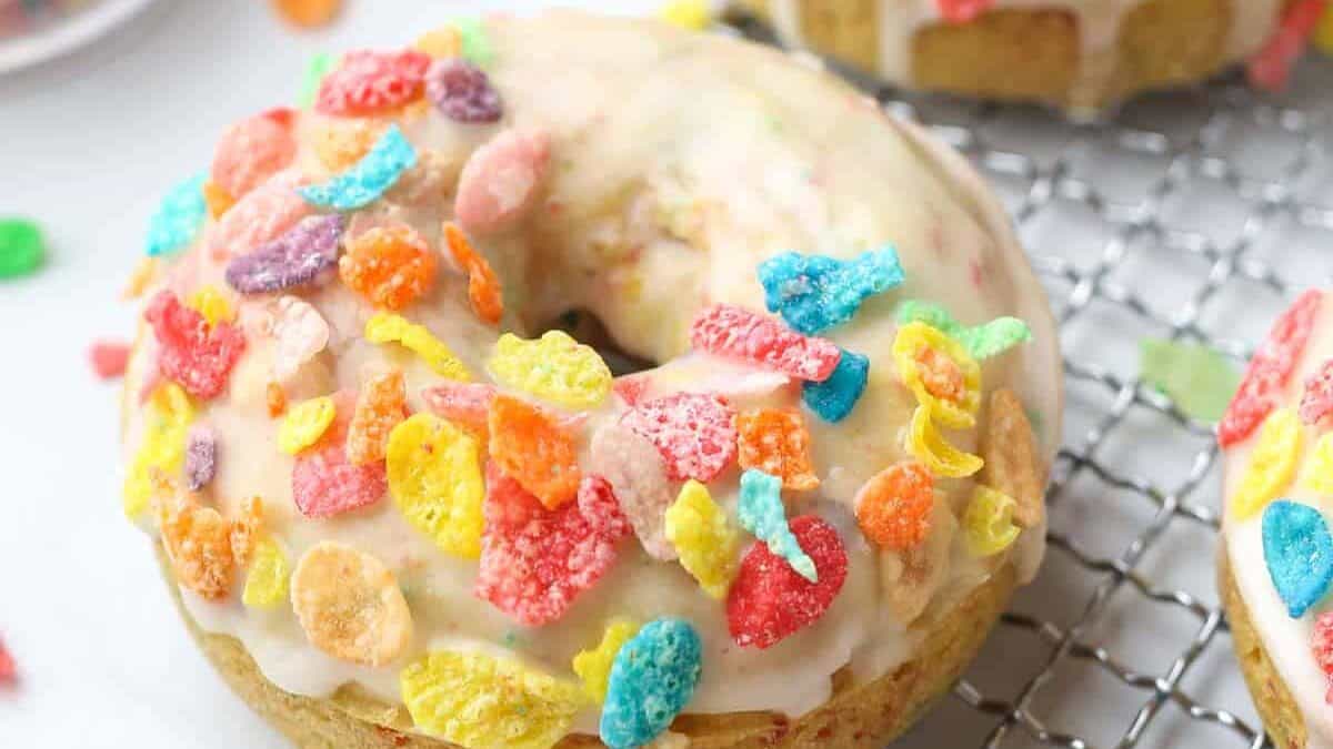 A donut with cereal on top.