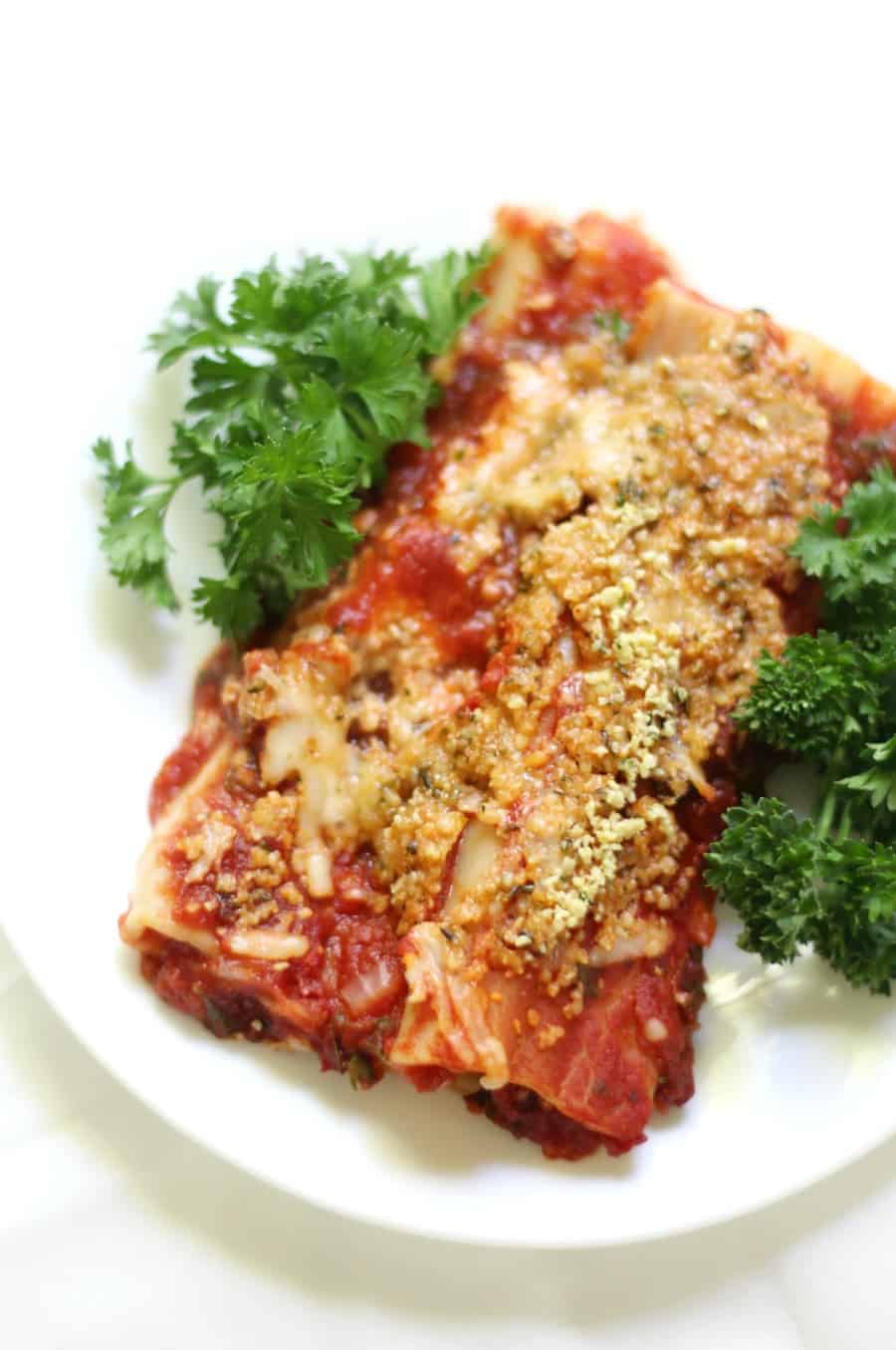 Classic Baked Gluten-Free + Vegan Manicotti (Soy-Free) | Strength and Sunshine @RebeccaGF666 No more missing out on your Italian favorite! A Classic Baked Gluten-Free & Vegan Manicotti recipe with homemade tomato sauce, a creamy dairy-free & soy-free cheesy filling, all topped with a homemade 2-ingredient "parmesan"! A perfect comfort food dinner the whole family will enjoy! #glutenfree #vegan #pasta #dinner #manicotti #dairyfree #soyfree #eggfree #glutenfreepasta / --
