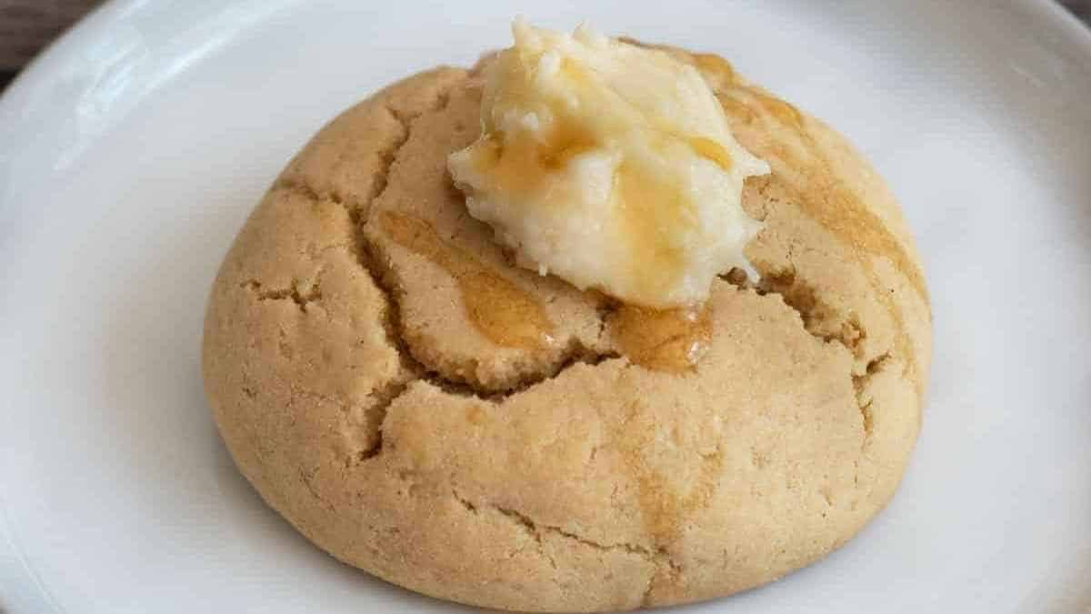 A cookie with butter on top.