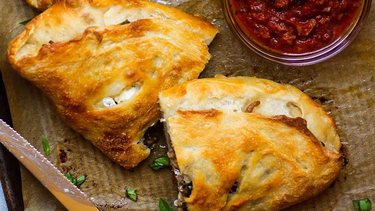 Goat Cheese, Basil, and Italian Sausage Calzones