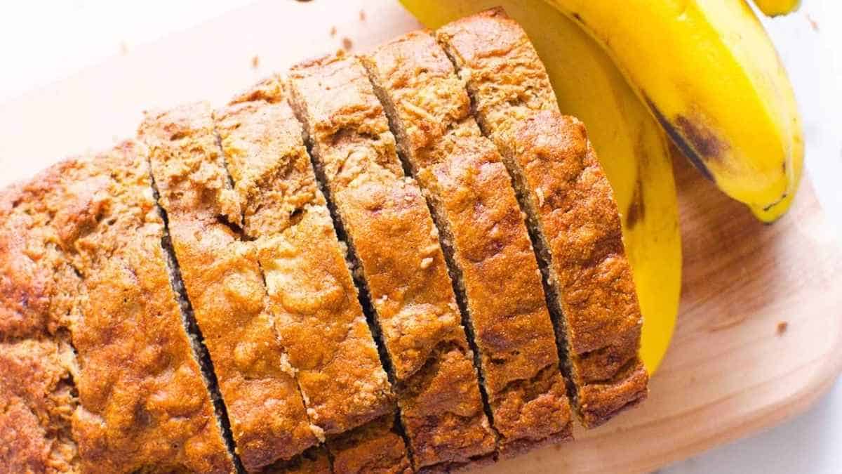 Sliced banana bread on a cutting board.