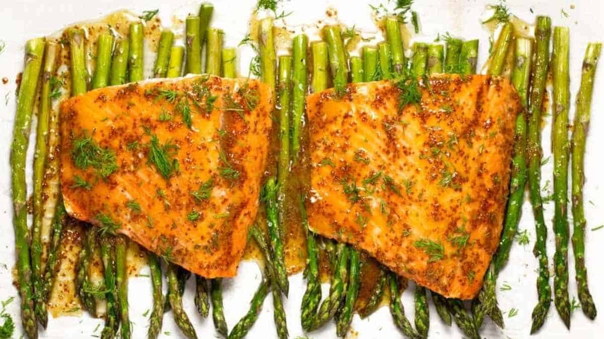 Salmon and asparagus on a baking sheet.