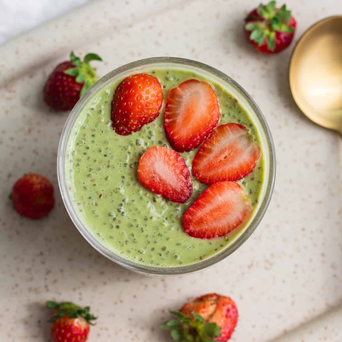 A high protein green smoothie with strawberries and chia seeds, perfect for a nutritious breakfast.