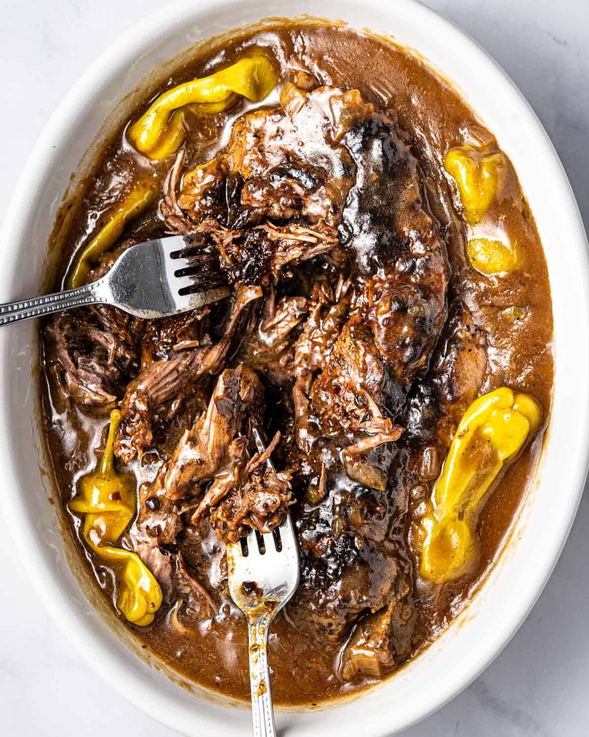 Serving bowl of Instant Pot Mississippi Pot Roast. 
