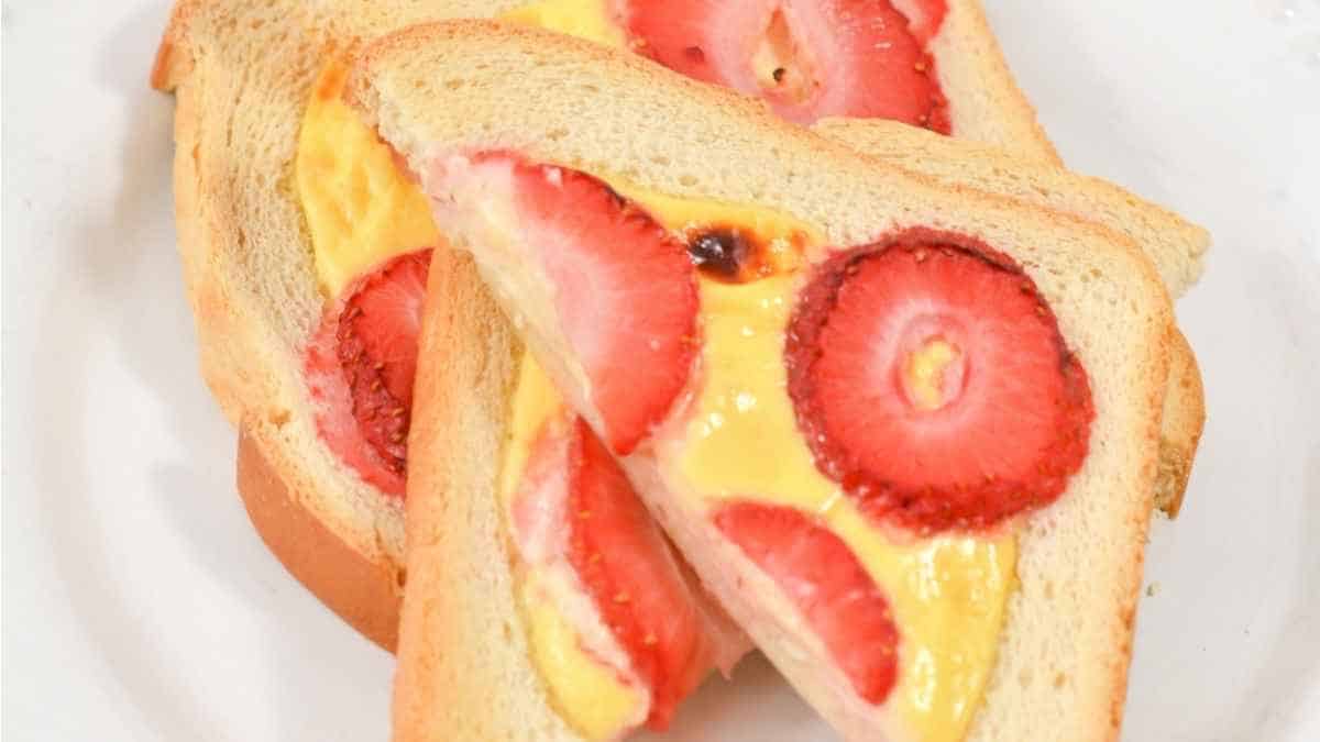 A slice of toast with strawberries on it.