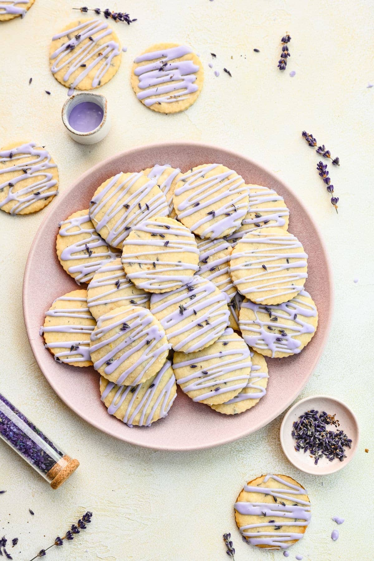 A plate of unique cookies with purple frosting.